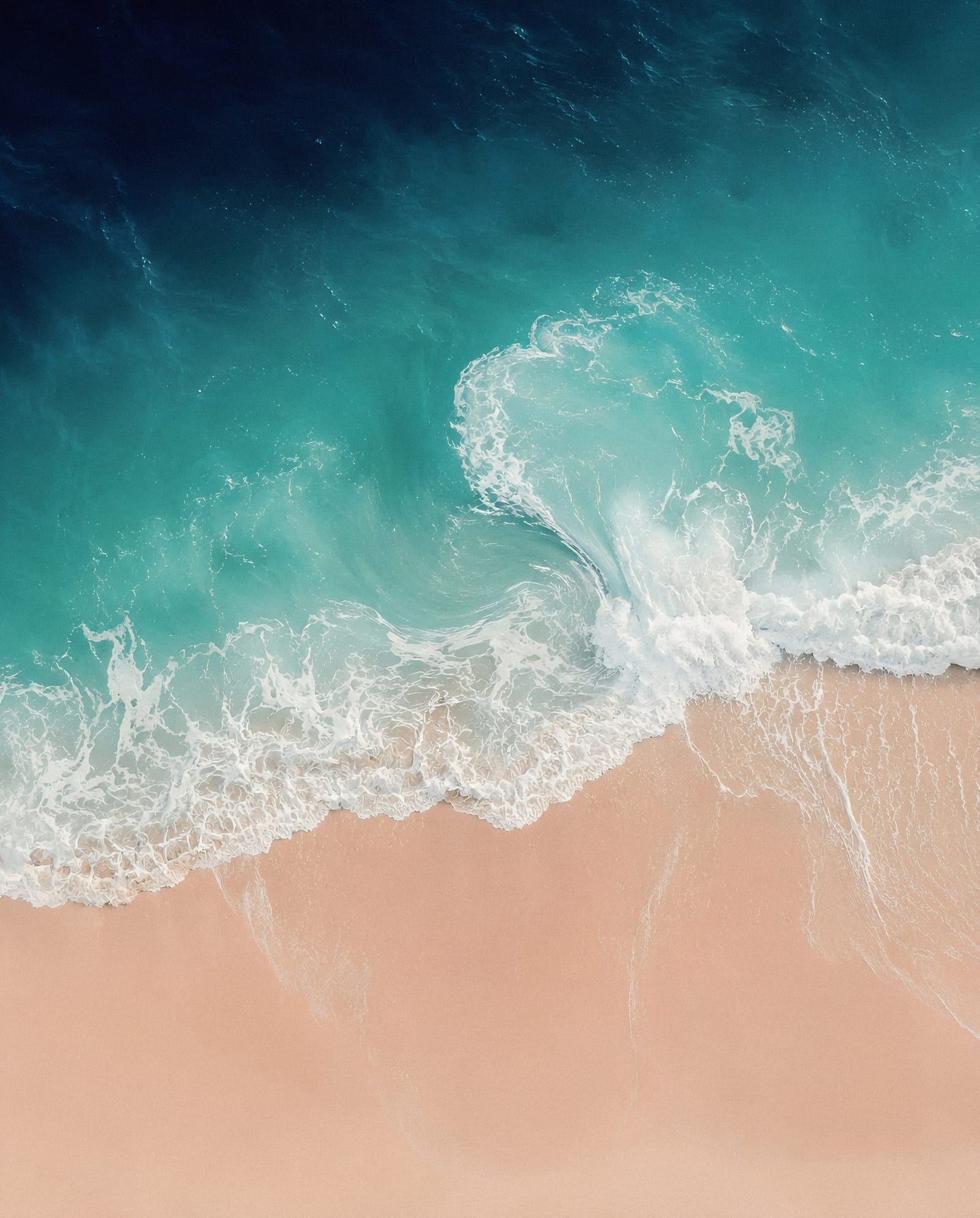 Serene Turquoise Waves On Sandy Beach
