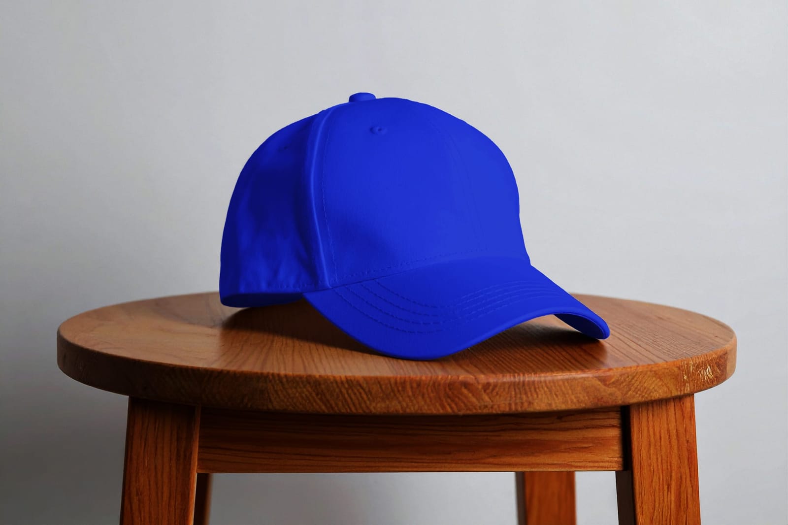 Minimalist Blue Baseball Cap Mockup on Wooden Stool