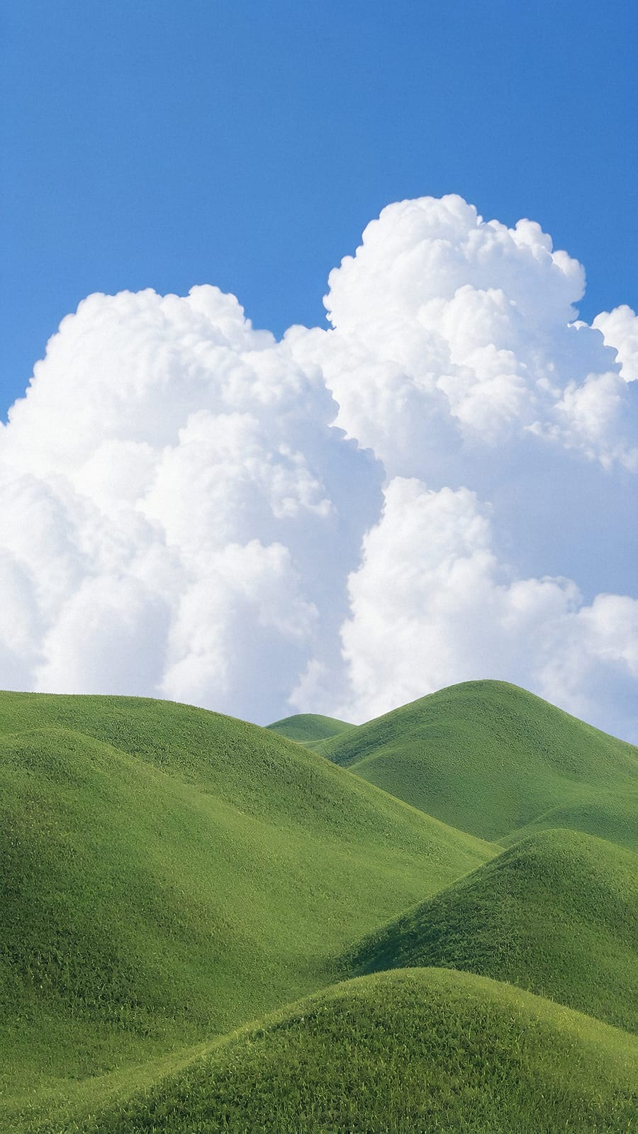Rolling Hills Under A Blue Sky