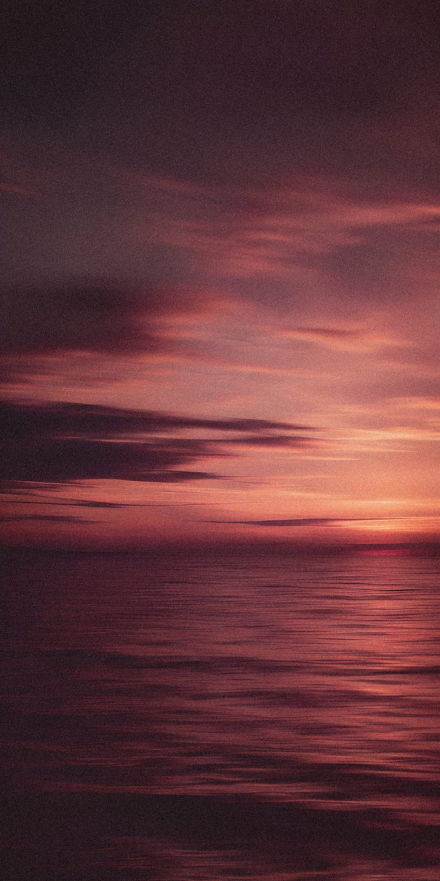 Serene Sunset Over Calm Ocean